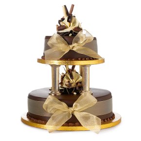 Moist chocolate tiered sponge cake decorating with a gold ribbon