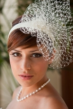 Made-up bride with fancy hair-piece