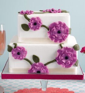 Two tier wedding cake with purple flower decoration