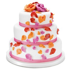 A three tier rich fruit cake covered with marzipan decorated with coloured sugar petals