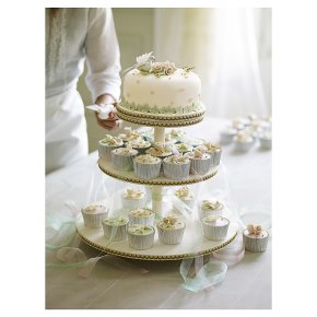 Romantic carousel cake with cupcakes