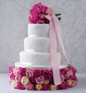 Sophisticated tiered wedding cake in white or ivory