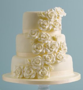 Wedding cake with white chocolate covering and delicate chocolate roses