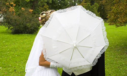 Be prepared on the big day with a bridal umbrella