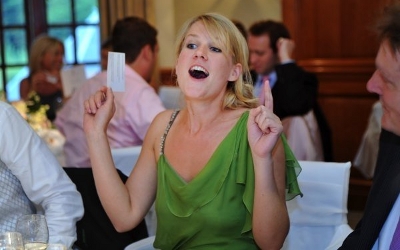 wedding guest playing an ice-breaking guessing game