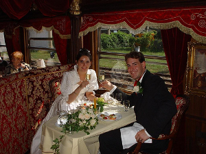 Couple toasting to their wedding aboard a special wedding train